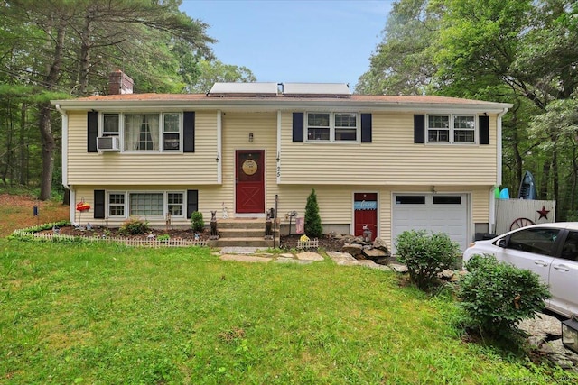 25 Ridgewood Rd, Willington, CT 06279 - raised ranch with a garage, a front lawn, a chimney, and driveway