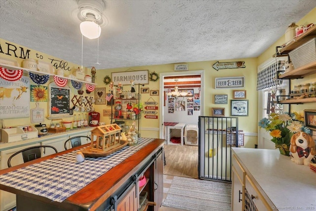 25 Ridgewood Rd, Willington, CT 06279 - kitchen with a textured ceiling, open shelves, and light wood-type flooring