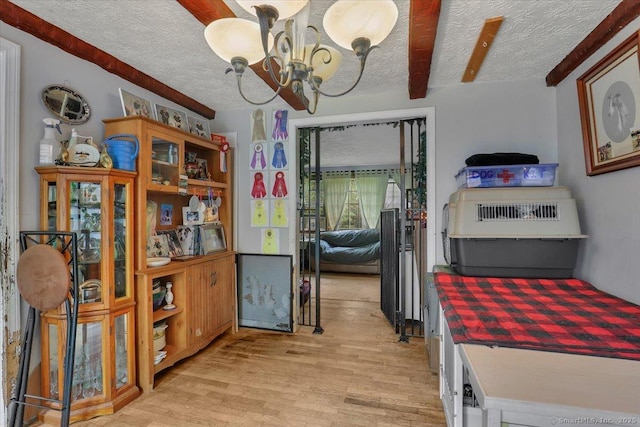 25 Ridgewood Rd, Willington, CT 06279 - dining room with a chandelier, a textured ceiling, and light wood-style flooring