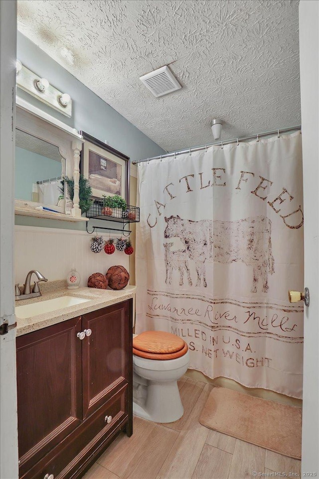 25 Ridgewood Rd, Willington, CT 06279 - bathroom featuring vanity, wood finished floors, a shower with shower curtain, and a textured ceiling