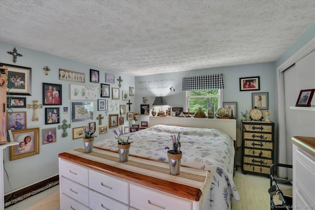 25 Ridgewood Rd, Willington, CT 06279 - bedroom with light wood-style flooring and a textured ceiling