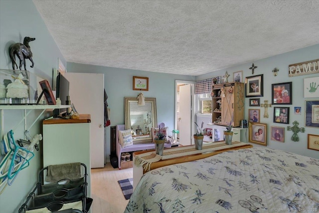 25 Ridgewood Rd, Willington, CT 06279 - bedroom featuring a textured ceiling and wood finished floors