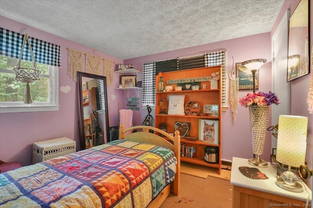 25 Ridgewood Rd, Willington, CT 06279 - bedroom featuring a textured ceiling and light wood-type flooring