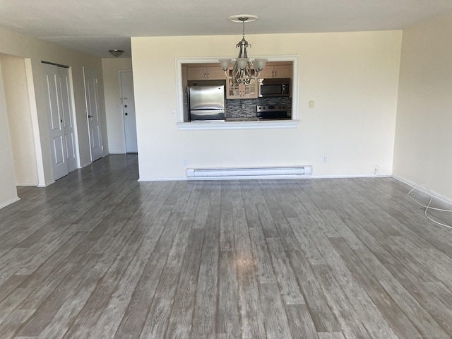 50 Birdseye St Unit 104, Stratford, CT 06615 - spare room featuring a baseboard heating unit, a chandelier, and wood finished floors