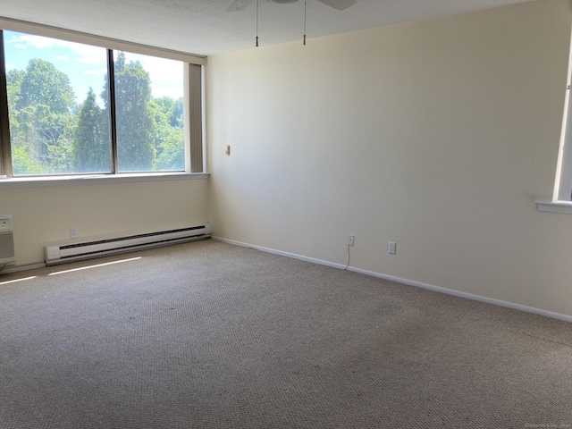 50 Birdseye St Unit 104, Stratford, CT 06615 - carpeted empty room featuring a baseboard radiator and ceiling fan