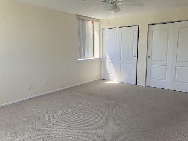 50 Birdseye St Unit 104, Stratford, CT 06615 - unfurnished bedroom with carpet flooring, two closets, and ceiling fan