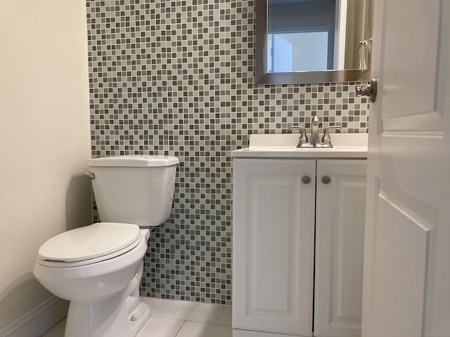 50 Birdseye St Unit 104, Stratford, CT 06615 - bathroom with decorative backsplash, vanity, and tile patterned flooring