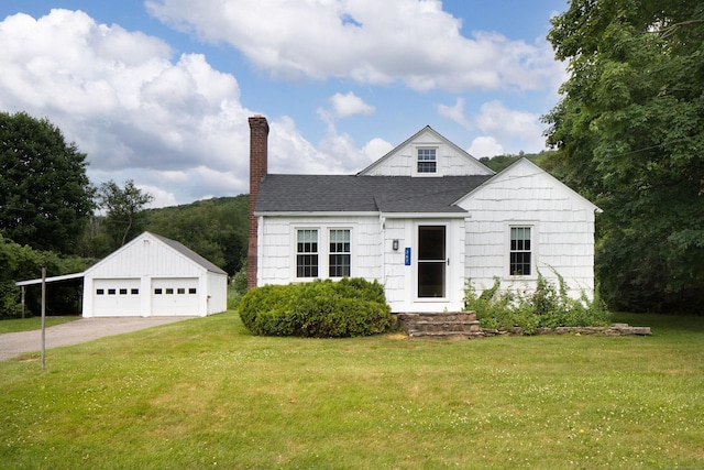 367 Norfolk Rd, North Canaan, CT 06024 - view of front of house with a detached garage, a chimney, a front lawn, and an outdoor structure
