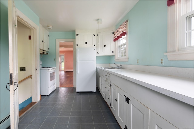 367 Norfolk Rd, North Canaan, CT 06024 - kitchen with white appliances, a baseboard heating unit, white cabinets, under cabinet range hood, and light countertops