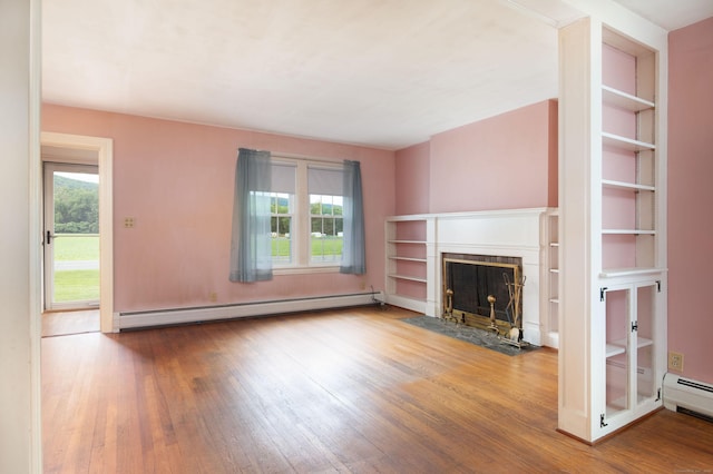 367 Norfolk Rd, North Canaan, CT 06024 - unfurnished living room with a baseboard heating unit, plenty of natural light, and wood-type flooring