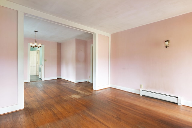 367 Norfolk Rd, North Canaan, CT 06024 - spare room featuring a baseboard heating unit, a chandelier, and wood finished floors