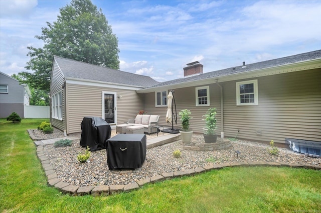 266 Ballfall Rd, Middletown, CT 06457 - rear view of house featuring an outdoor hangout area, a chimney, a yard, and a patio