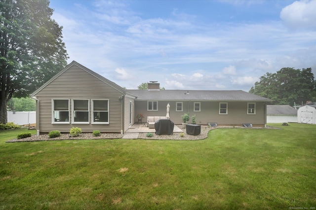 266 Ballfall Rd, Middletown, CT 06457 - back of house with a patio, a chimney, a storage unit, and an outdoor living space