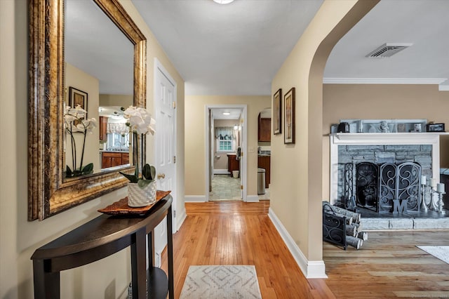 266 Ballfall Rd, Middletown, CT 06457 - hallway with arched walkways and light wood-style flooring