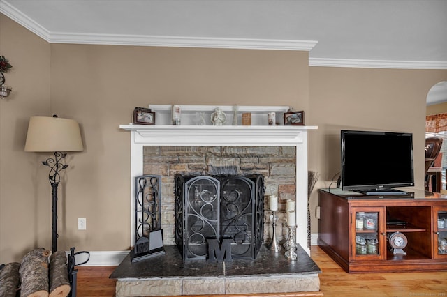 266 Ballfall Rd, Middletown, CT 06457 - detailed view of wood finished floors, ornamental molding, arched walkways, and a fireplace