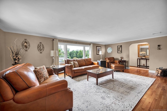 266 Ballfall Rd, Middletown, CT 06457 - living area with arched walkways, light wood-style flooring, and ornamental molding