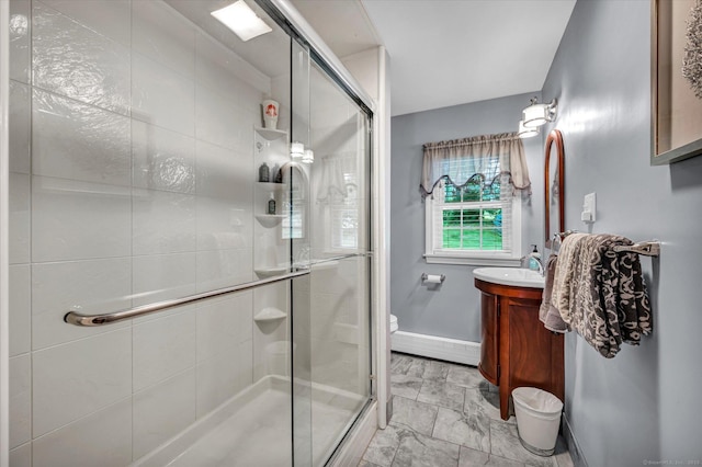 266 Ballfall Rd, Middletown, CT 06457 - full bathroom featuring vanity, a stall shower, marble look tile flooring, and a baseboard radiator