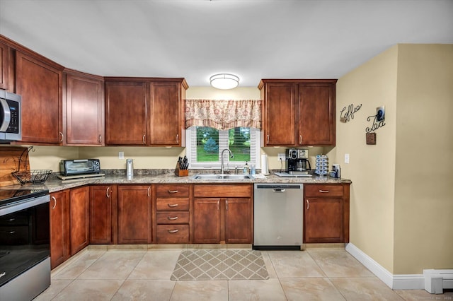 266 Ballfall Rd, Middletown, CT 06457 - kitchen with stainless steel appliances, stone countertops, and light tile patterned flooring