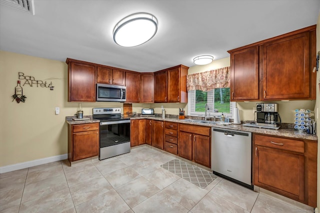 266 Ballfall Rd, Middletown, CT 06457 - kitchen featuring stainless steel appliances, stone countertops, and light tile patterned floors