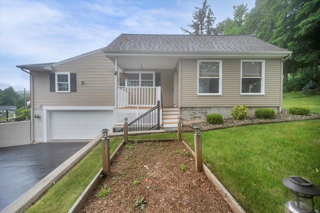 266 Ballfall Rd, Middletown, CT 06457 - view of front of home with asphalt driveway, a front yard, an attached garage, and a shingled roof