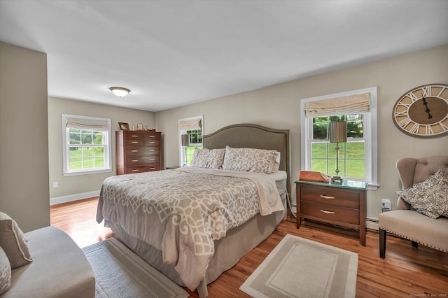 266 Ballfall Rd, Middletown, CT 06457 - bedroom with wood finished floors and baseboard heating