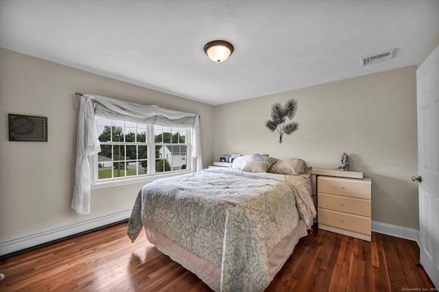 266 Ballfall Rd, Middletown, CT 06457 - bedroom with a baseboard heating unit and dark wood-type flooring