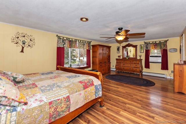 31 Bob White Way, Plainfield, CT 06354 - bedroom with a baseboard radiator, wood finished floors, and multiple windows