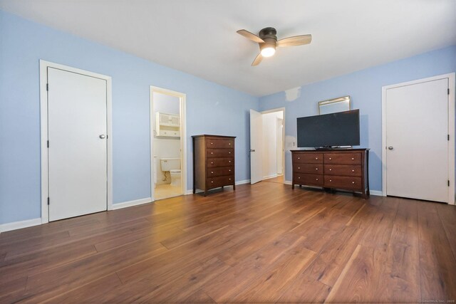 1060 New Haven Ave Apt 7, Milford, CT 06460 - unfurnished bedroom featuring dark wood finished floors, ensuite bathroom, and a ceiling fan