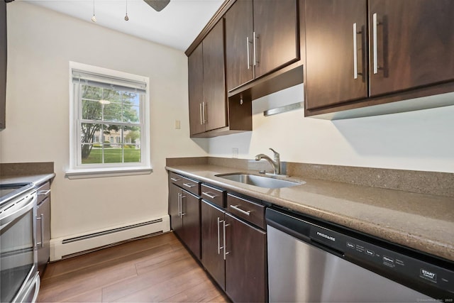 1060 New Haven Ave Apt 7, Milford, CT 06460 - kitchen with appliances with stainless steel finishes, a baseboard radiator, light wood-type flooring, and dark brown cabinetry