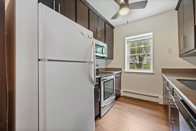 1060 New Haven Ave Apt 7, Milford, CT 06460 - kitchen with appliances with stainless steel finishes, baseboard heating, dark brown cabinetry, light wood-type flooring, and ceiling fan