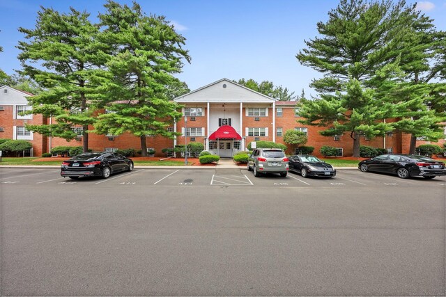 1060 New Haven Ave Apt 7, Milford, CT 06460 - view of front facade with uncovered parking and brick siding