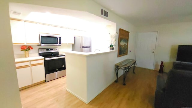 59 Leafwood Ln Apt 275, Groton, CT 06340 - kitchen with appliances with stainless steel finishes, light wood-style floors, and white cabinets