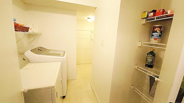 59 Leafwood Ln Apt 275, Groton, CT 06340 - laundry area with washing machine and dryer and tile patterned flooring
