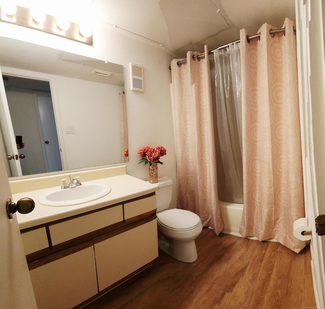 59 Leafwood Ln Apt 275, Groton, CT 06340 - bathroom featuring wood finished floors, vanity, and shower / bath combo with shower curtain
