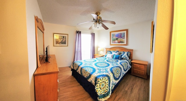 59 Leafwood Ln Apt 275, Groton, CT 06340 - bedroom with wood finished floors, a textured ceiling, and a ceiling fan