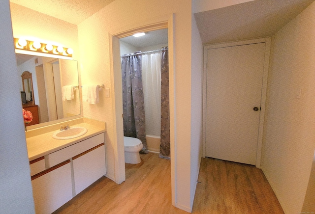 59 Leafwood Ln Apt 275, Groton, CT 06340 - full bathroom featuring wood finished floors, vanity, and shower / bath combo