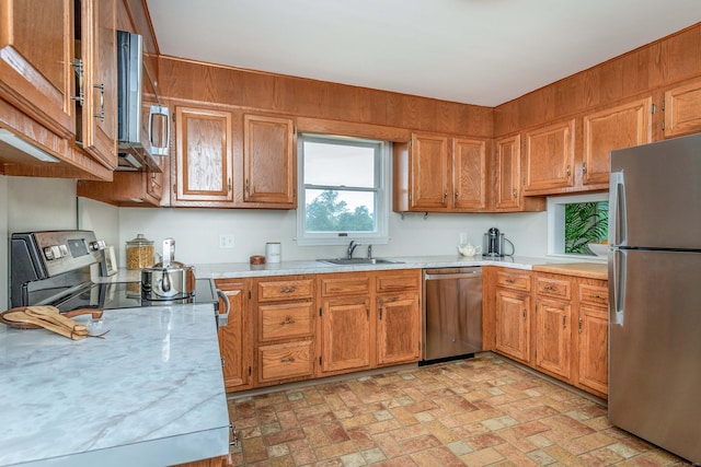 23 Bell Hill Rd, Washington, CT 06793 - kitchen with stainless steel appliances, brown cabinets, and brick patterned flooring
