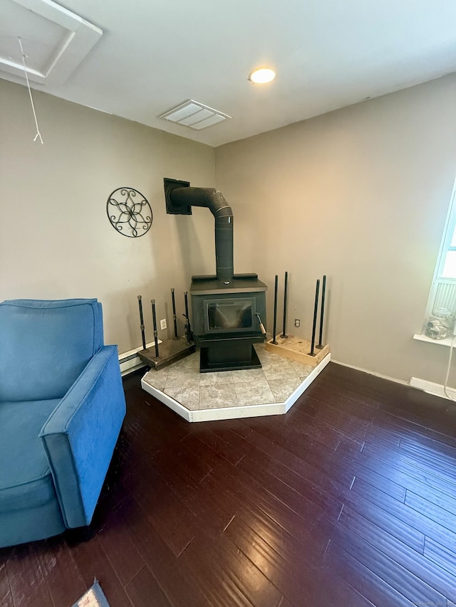 13 Myrna Dr, Marlborough, CT 06447 - living area featuring a wood stove, wood-type flooring, attic access, and recessed lighting