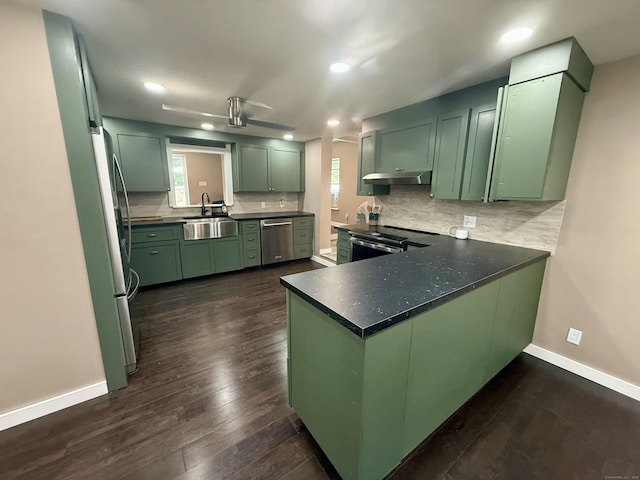 13 Myrna Dr, Marlborough, CT 06447 - kitchen featuring green cabinets, stainless steel appliances, decorative backsplash, recessed lighting, and under cabinet range hood