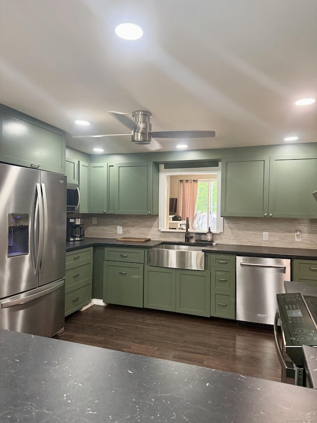 13 Myrna Dr, Marlborough, CT 06447 - kitchen with green cabinetry, stainless steel appliances, backsplash, recessed lighting, and dark wood-style flooring