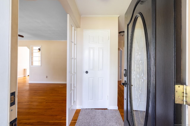 6 French St, Bristol, CT 06010 - foyer featuring wood finished floors and crown molding