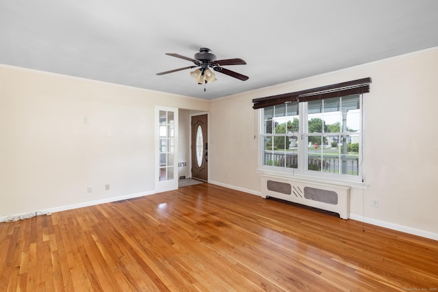 6 French St, Bristol, CT 06010 - unfurnished room featuring radiator heating unit, crown molding, light wood-style flooring, and a ceiling fan