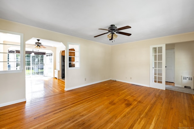 6 French St, Bristol, CT 06010 - empty room featuring ceiling fan, light wood-type flooring, crown molding, and radiator