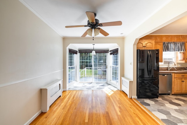 6 French St, Bristol, CT 06010 - unfurnished dining area with light wood-type flooring, crown molding, ceiling fan, and arched walkways