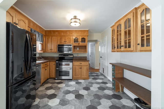 6 French St, Bristol, CT 06010 - kitchen with stainless steel appliances, tile patterned floors, dark countertops, and glass insert cabinets