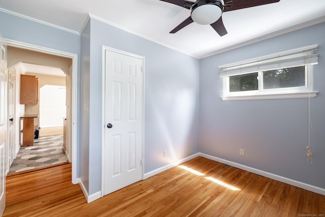 6 French St, Bristol, CT 06010 - unfurnished bedroom with crown molding, light wood-type flooring, a closet, and ceiling fan