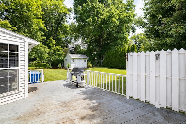 6 French St, Bristol, CT 06010 - wooden terrace featuring grilling area, a yard, a storage shed, and view of scattered trees