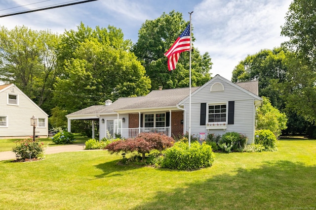 6 French St, Bristol, CT 06010 - view of front of property with concrete driveway, a front lawn, a carport, and brick siding