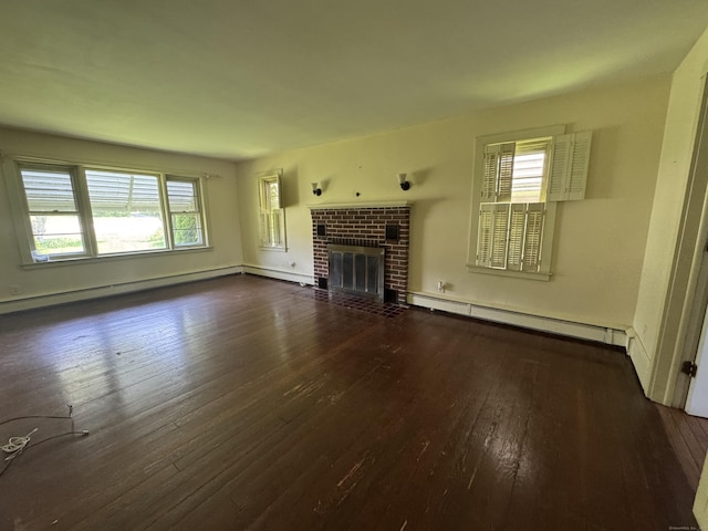 605 Laurel Hill Rd, Norwich, CT 06360 - unfurnished living room with a baseboard heating unit, hardwood / wood-style flooring, a fireplace, and baseboard heating