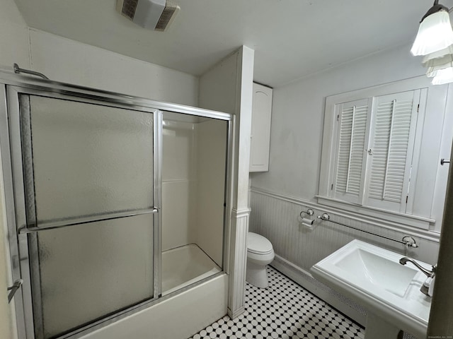 605 Laurel Hill Rd, Norwich, CT 06360 - full bathroom with wainscoting and shower / bath combination with glass door
